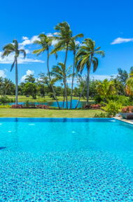 east beach estate pool view overlooking waterfront and golf course at dorado beach
