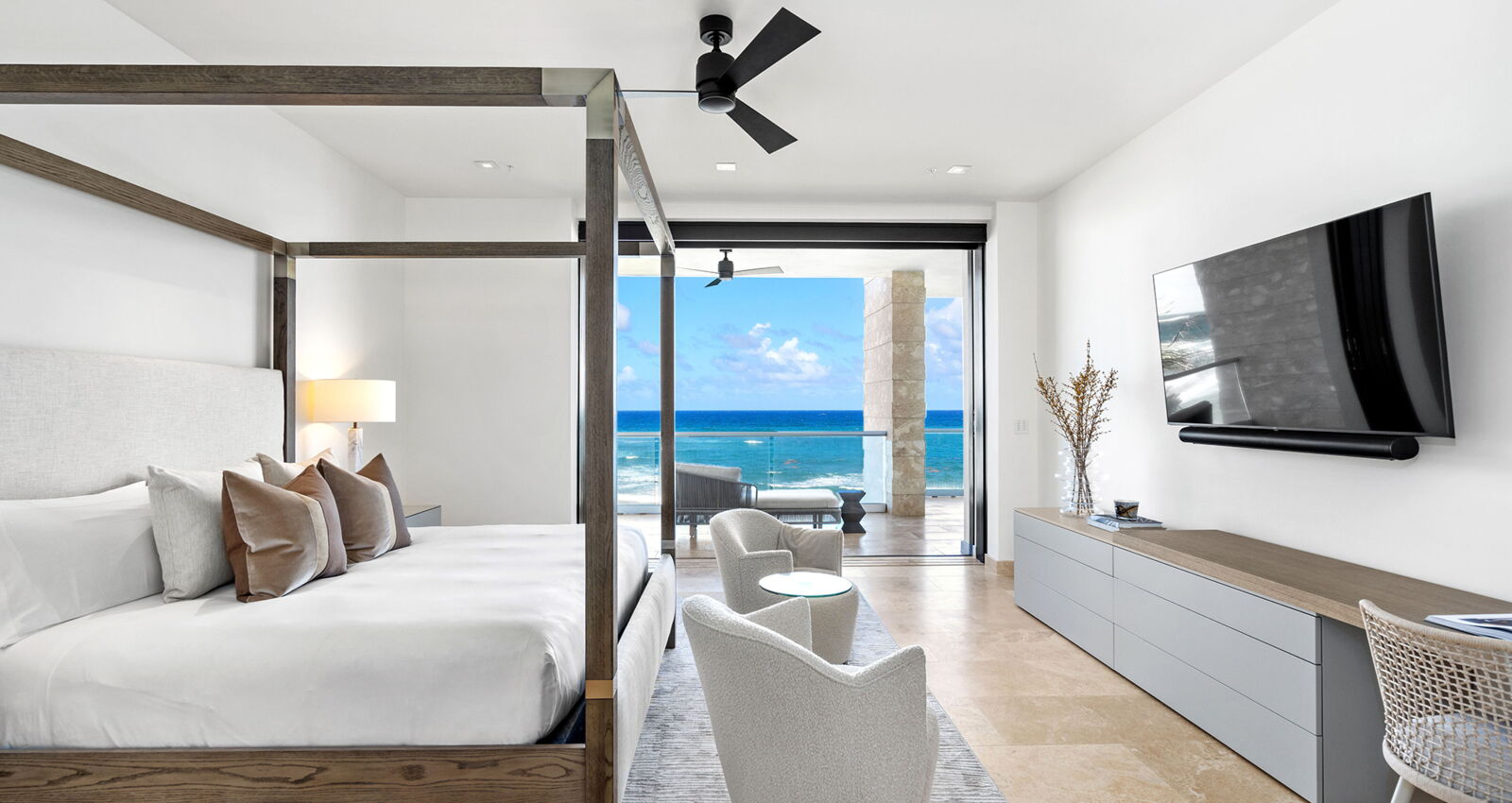 west point ritz-carlton reserve residence modern master bedroom with oceanfront balcony